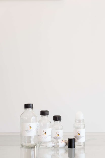 Women Fragrance Oil bottles in various sizes displayed on a clean surface with a neutral background.